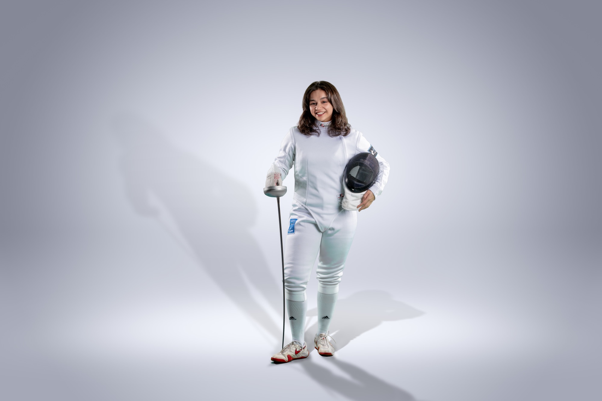 Coach Gillian Schultz in fencing gear